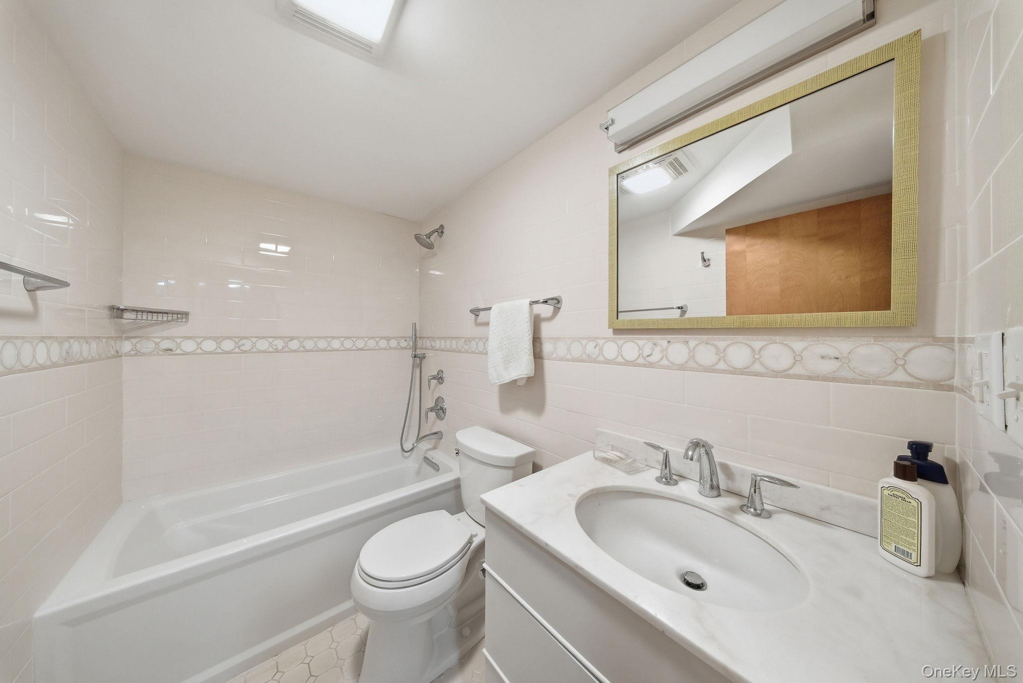 736 Highway 94 Warwick, NY 10921 - Photo 42 of 49 a bathroom with a sink a toilet and a bathtub