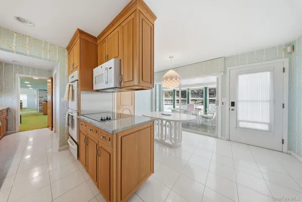 a kitchen with a sink a counter space and appliances