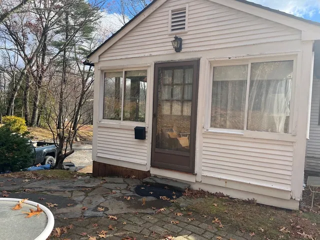 a view of a room that has a bed