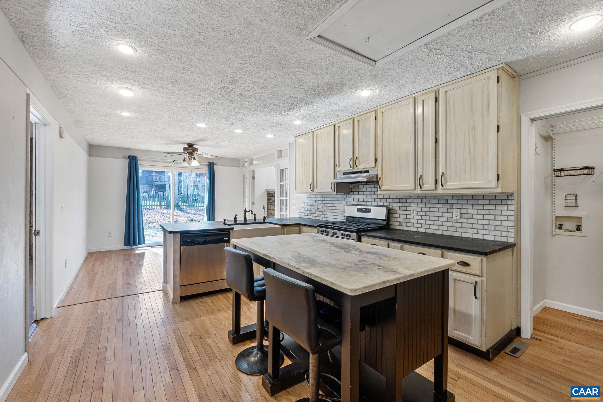 30 Colonial Road Palmyra, VA 22963 - Photo 11 of 30 a kitchen with a table chairs sink and cabinets