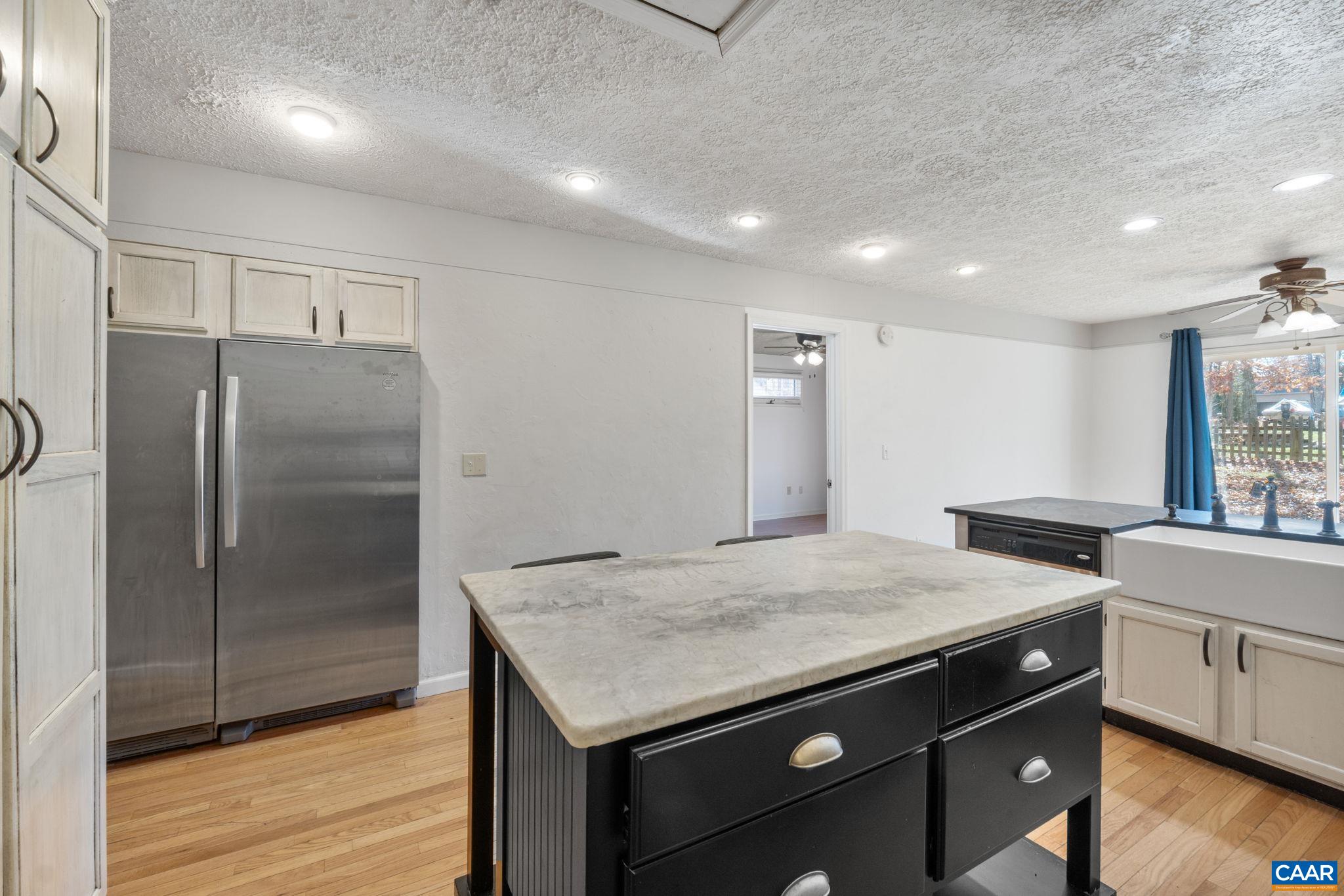 30 Colonial Road Palmyra, VA 22963 - Photo 12 of 30 a kitchen that has a sink a refrigerator and wooden floor