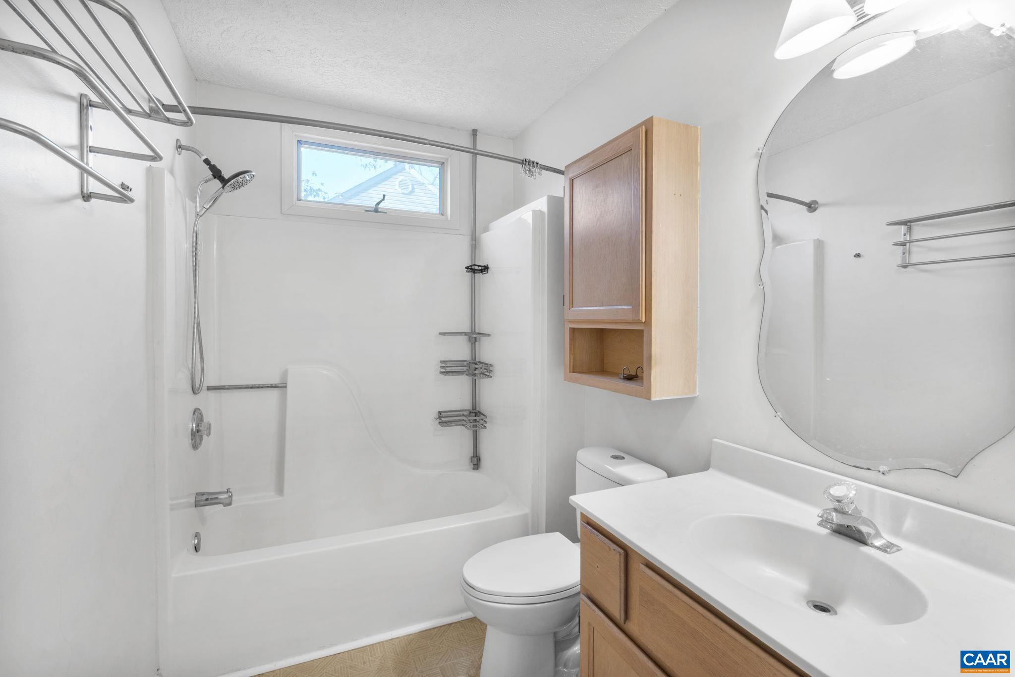 30 Colonial Road Palmyra, VA 22963 - Photo 21 of 30 a bathroom with a sink toilet and shower