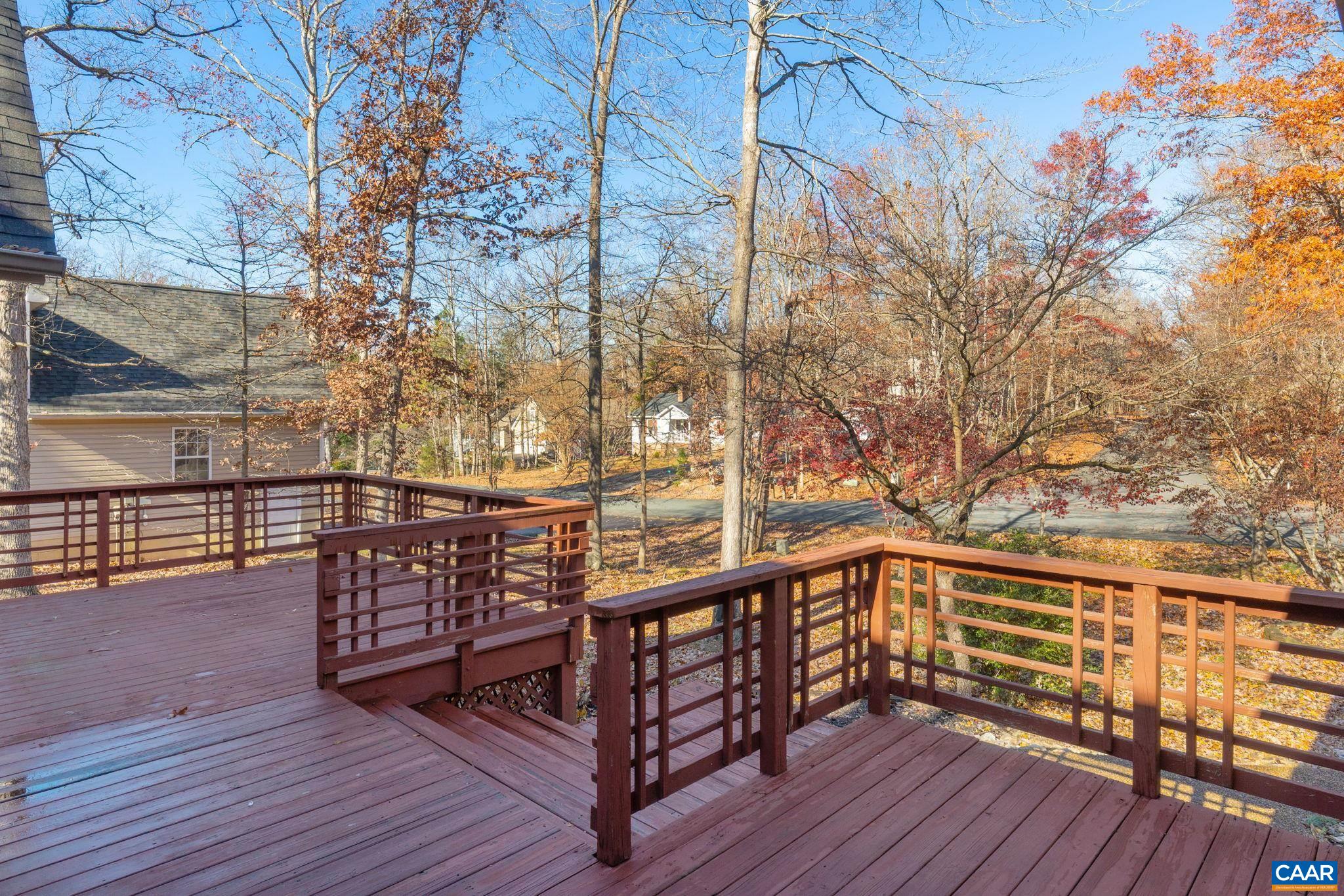30 Colonial Road Palmyra, VA 22963 - Photo 27 of 30 a view of a balcony with wooden floor and bench