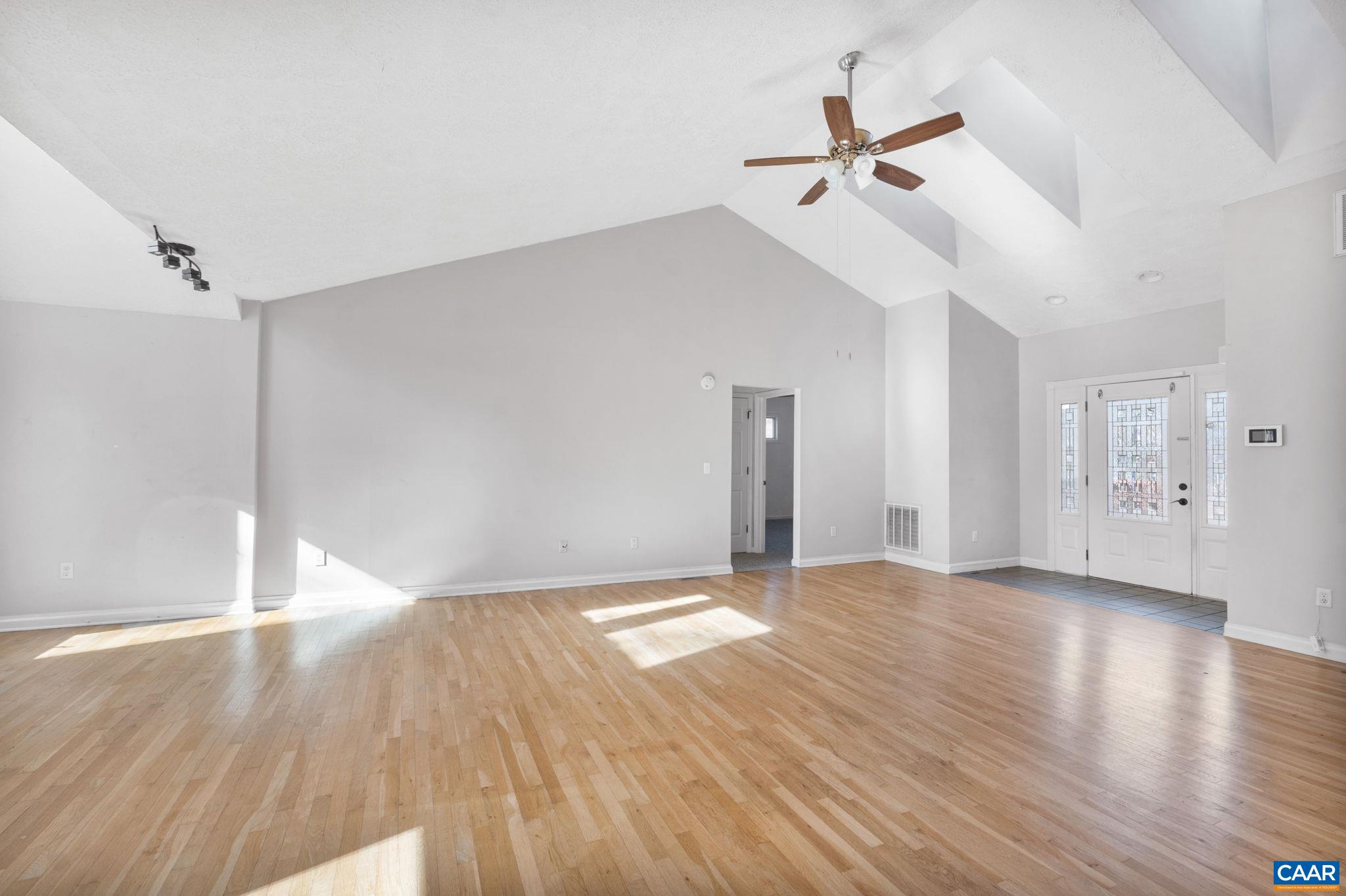 30 Colonial Road Palmyra, VA 22963 - Photo 7 of 30 a view of empty room with wooden floor and ceiling fan