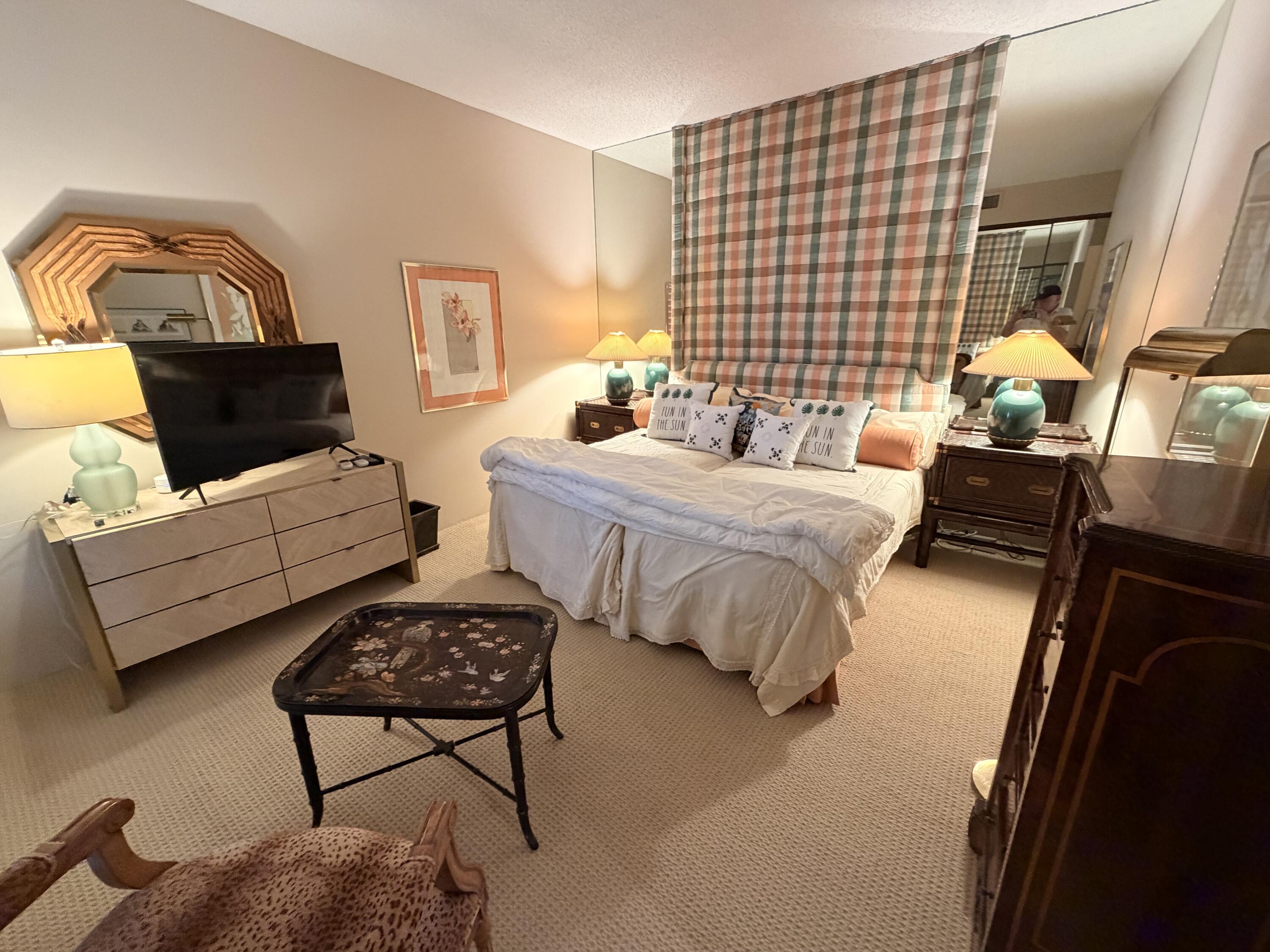 714 Inverness Drive Rancho Mirage, CA 92270 - Photo 11 of 16 a bedroom with bed couch and window