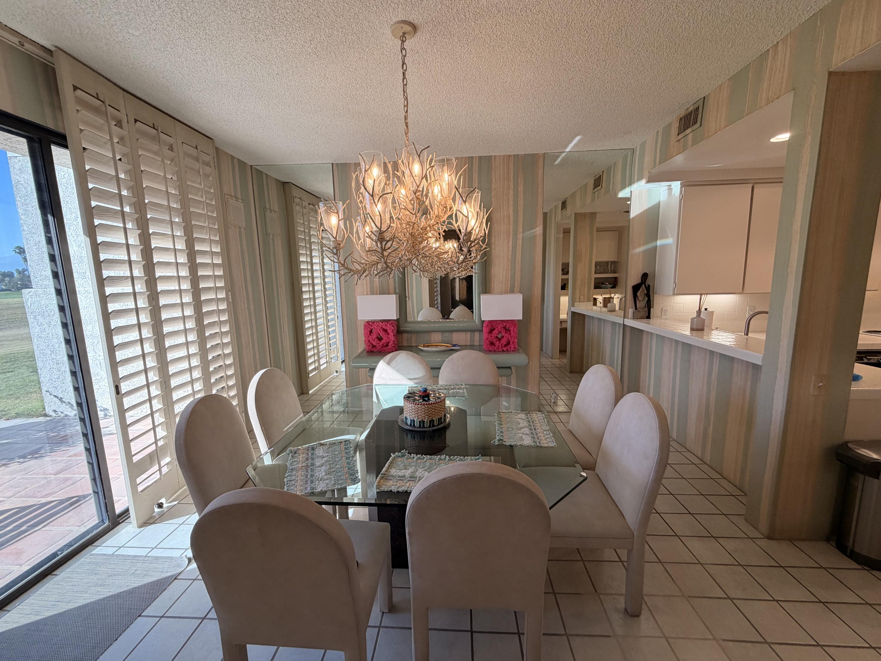 714 Inverness Drive Rancho Mirage, CA 92270 - Photo 4 of 16 a dining room with furniture and window
