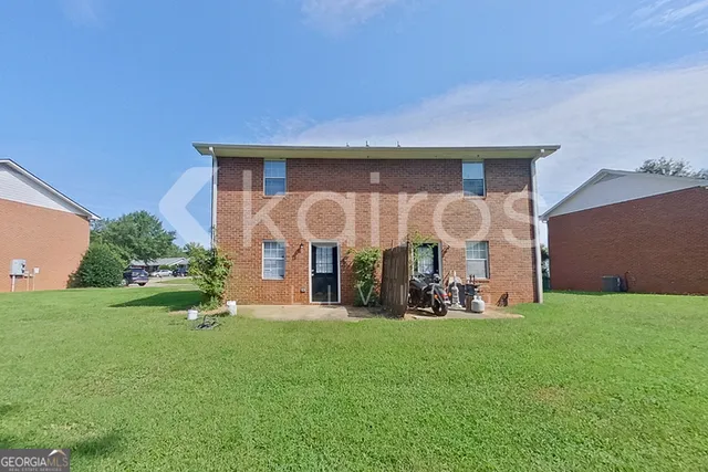 a front view of house with garden and porch