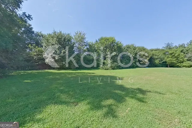 a view of a green field with clear sky