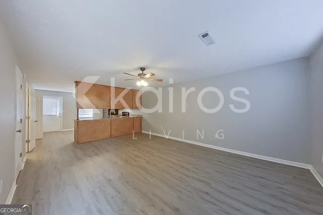 a view of a livingroom with wooden floor