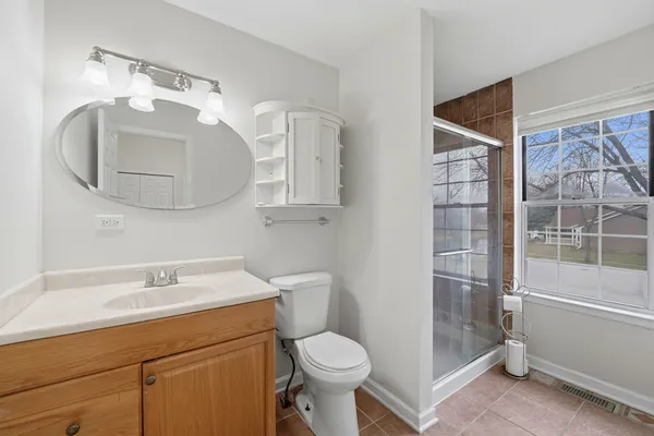 a bathroom with a toilet sink and shower