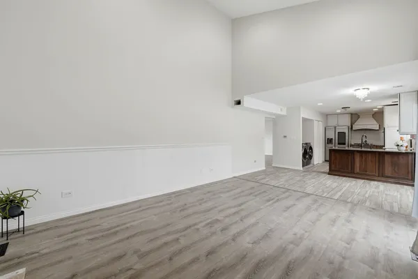 a view of kitchen and empty room