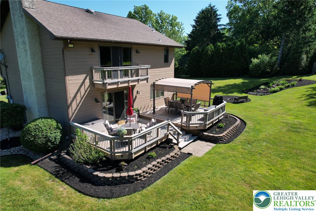 3470 Brodhead Road Bethlehem, PA 18020 - Photo 13 of 84 A spacious wooden deck provides ample outdoor living space, perfect for entertaining.