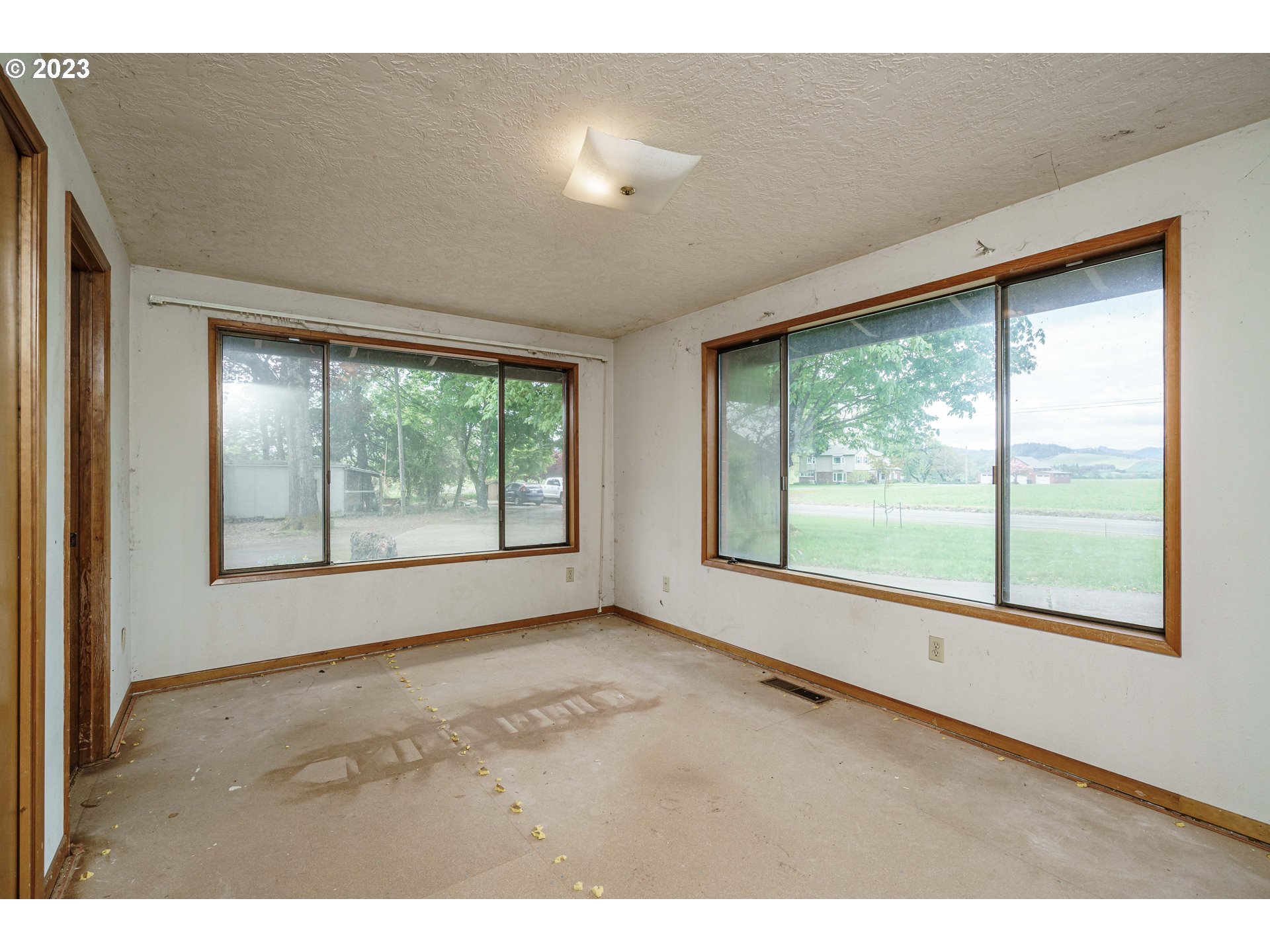 6300 Southwest Minter Bridge Road Hillsboro, OR 97123 - Photo 19 of 32 a view of an empty room with a window