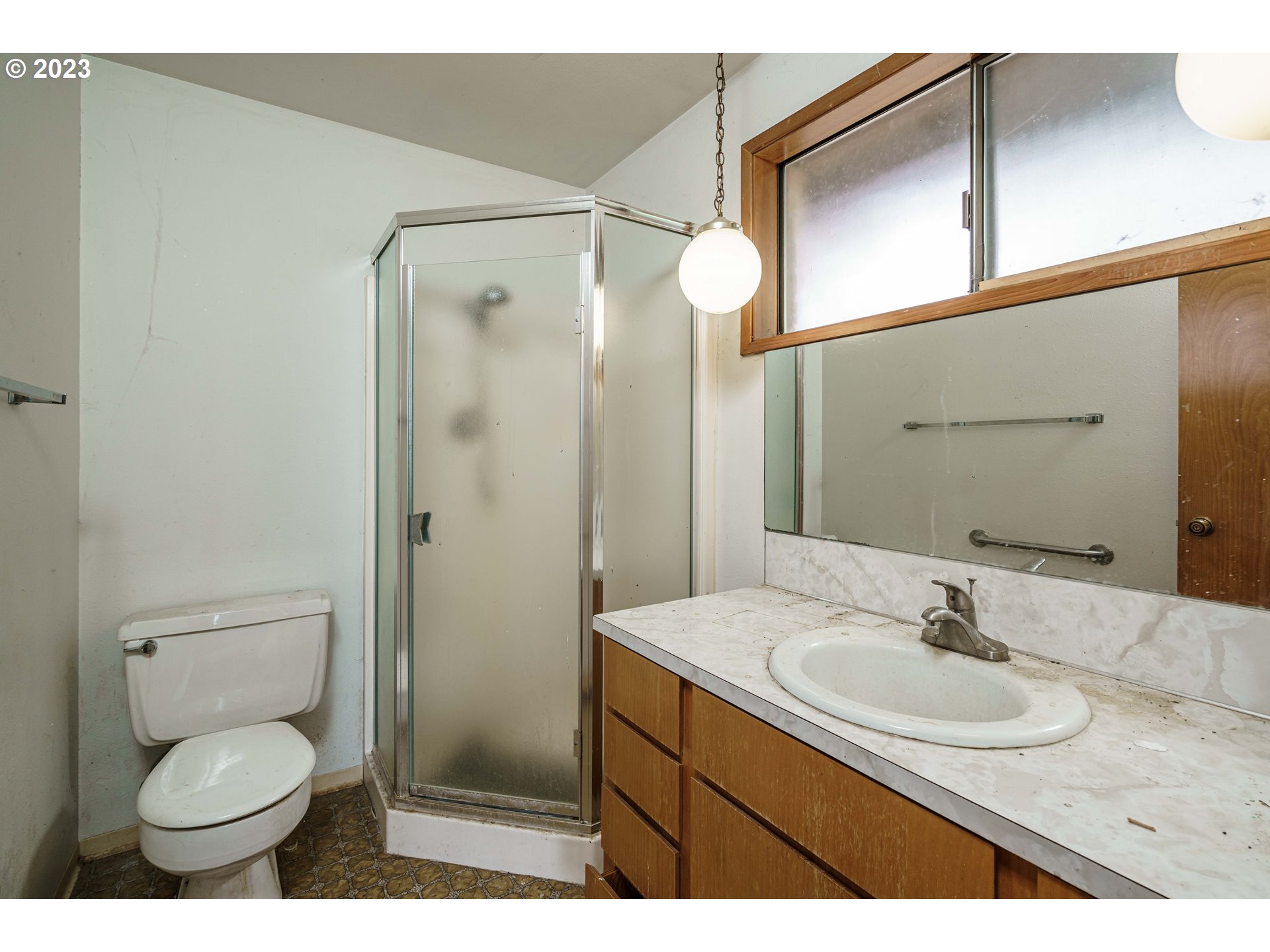 6300 Southwest Minter Bridge Road Hillsboro, OR 97123 - Photo 20 of 32 a bathroom with a sink toilet a mirror and shower
