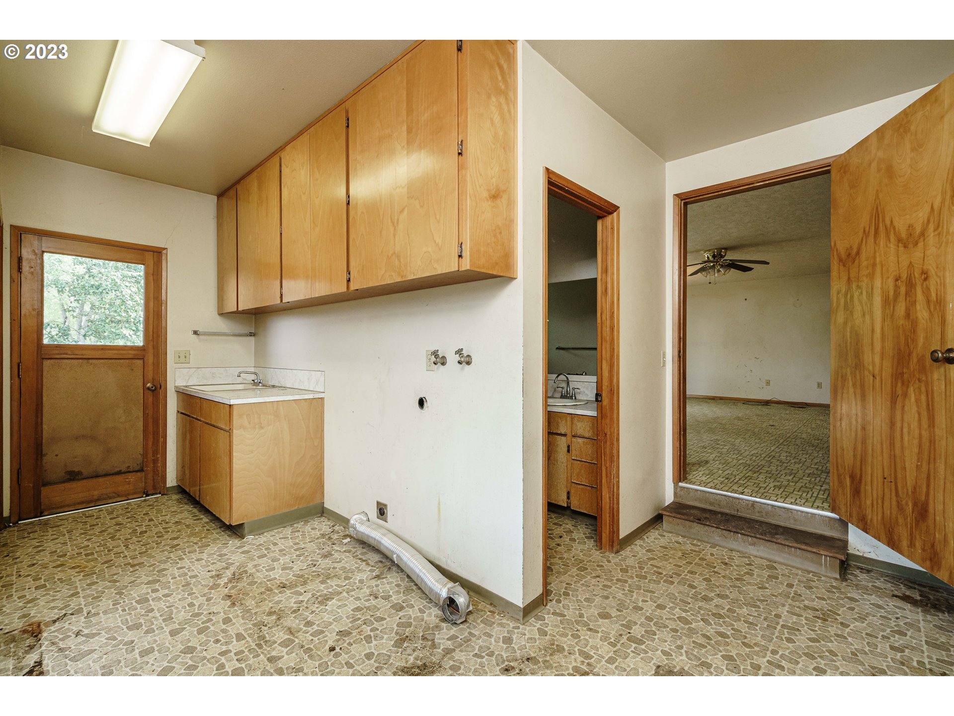 6300 Southwest Minter Bridge Road Hillsboro, OR 97123 - Photo 24 of 32 a kitchen with a refrigerator and a sink