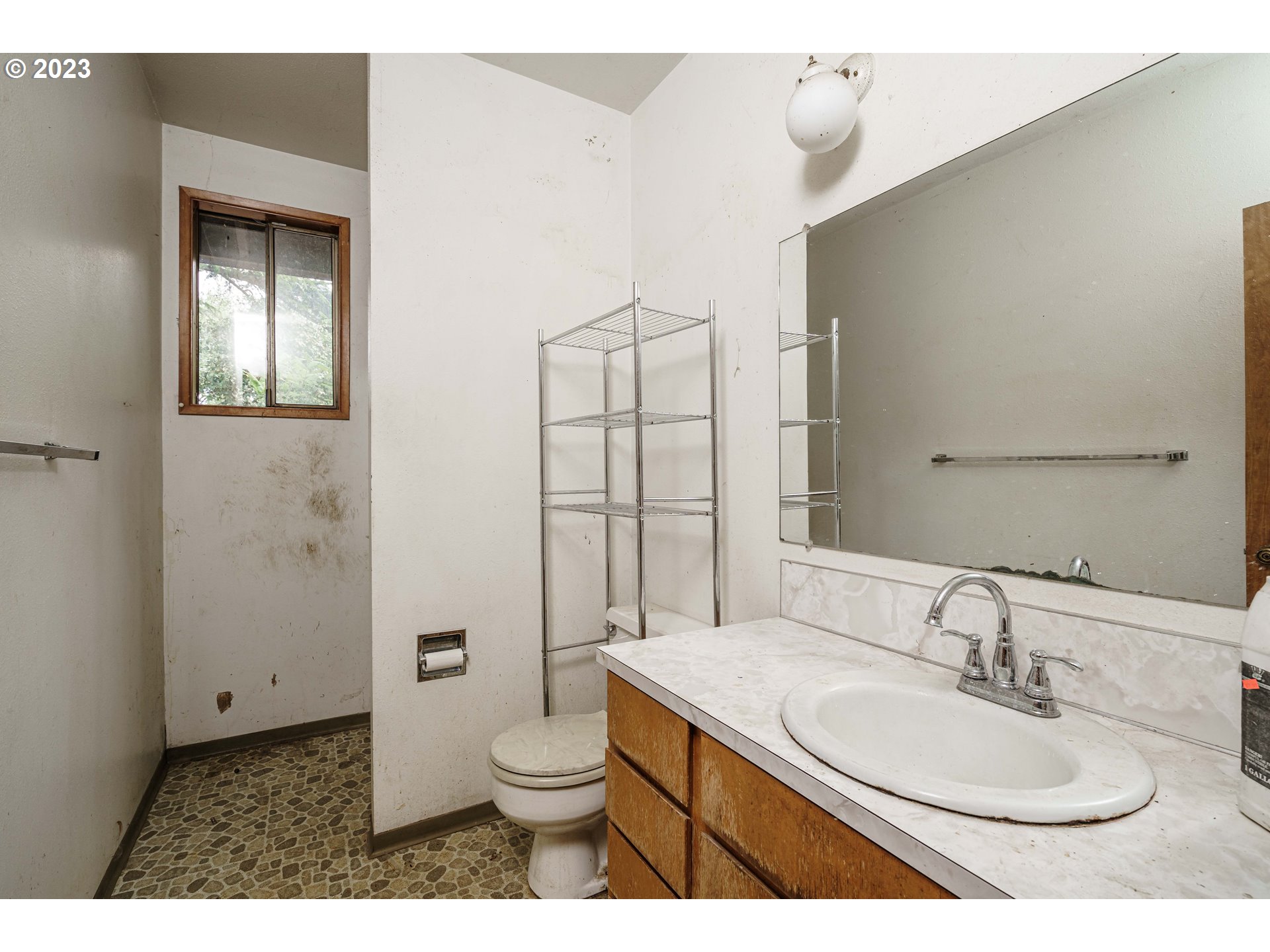 6300 Southwest Minter Bridge Road Hillsboro, OR 97123 - Photo 25 of 32 a bathroom with a granite countertop sink toilet and shower