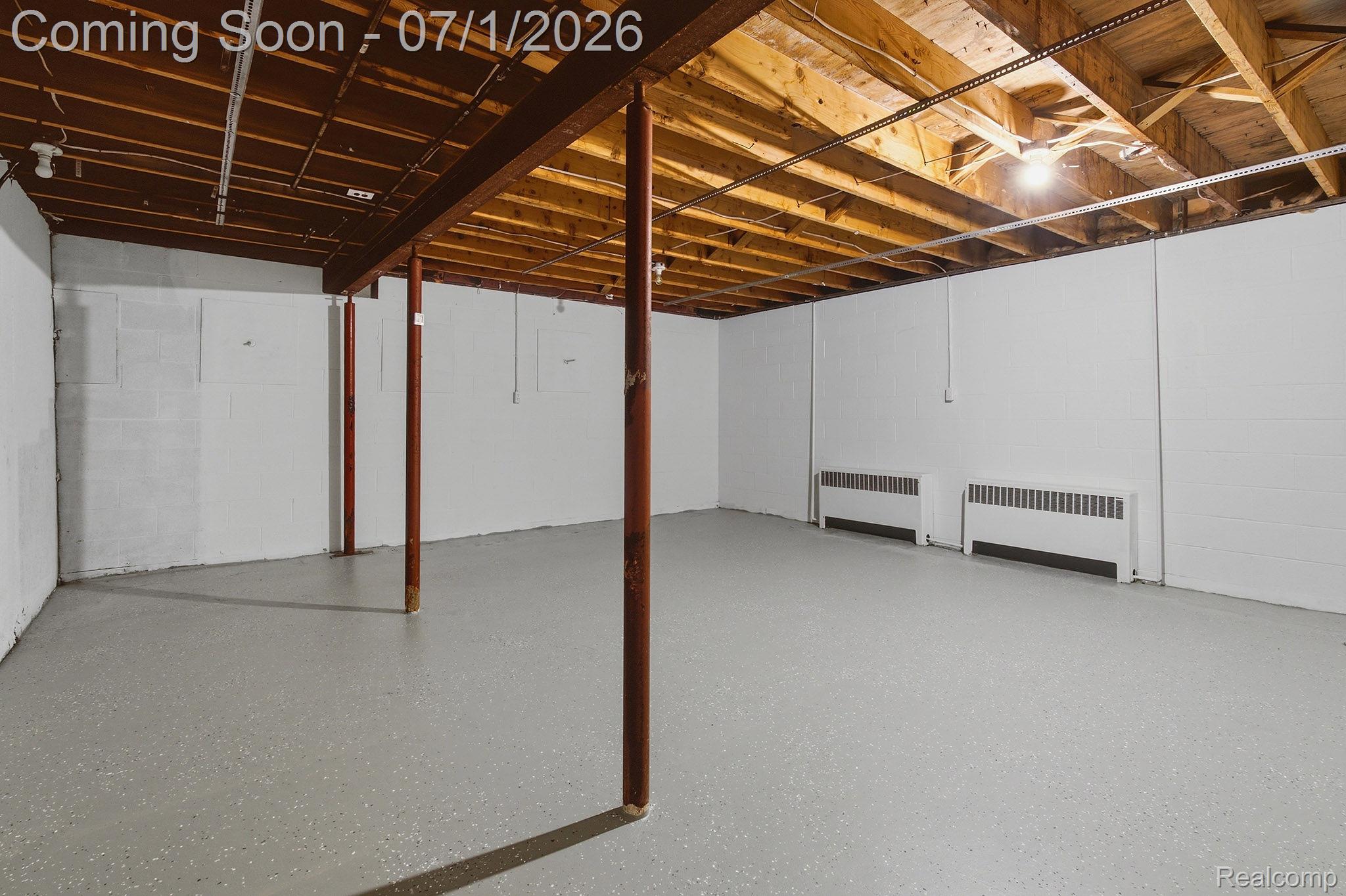 4762 Lonsberry Road Columbiaville, MI 48421 - Photo 27 of 36 Unfinished basement featuring exposed wood ceiling joists and support beams