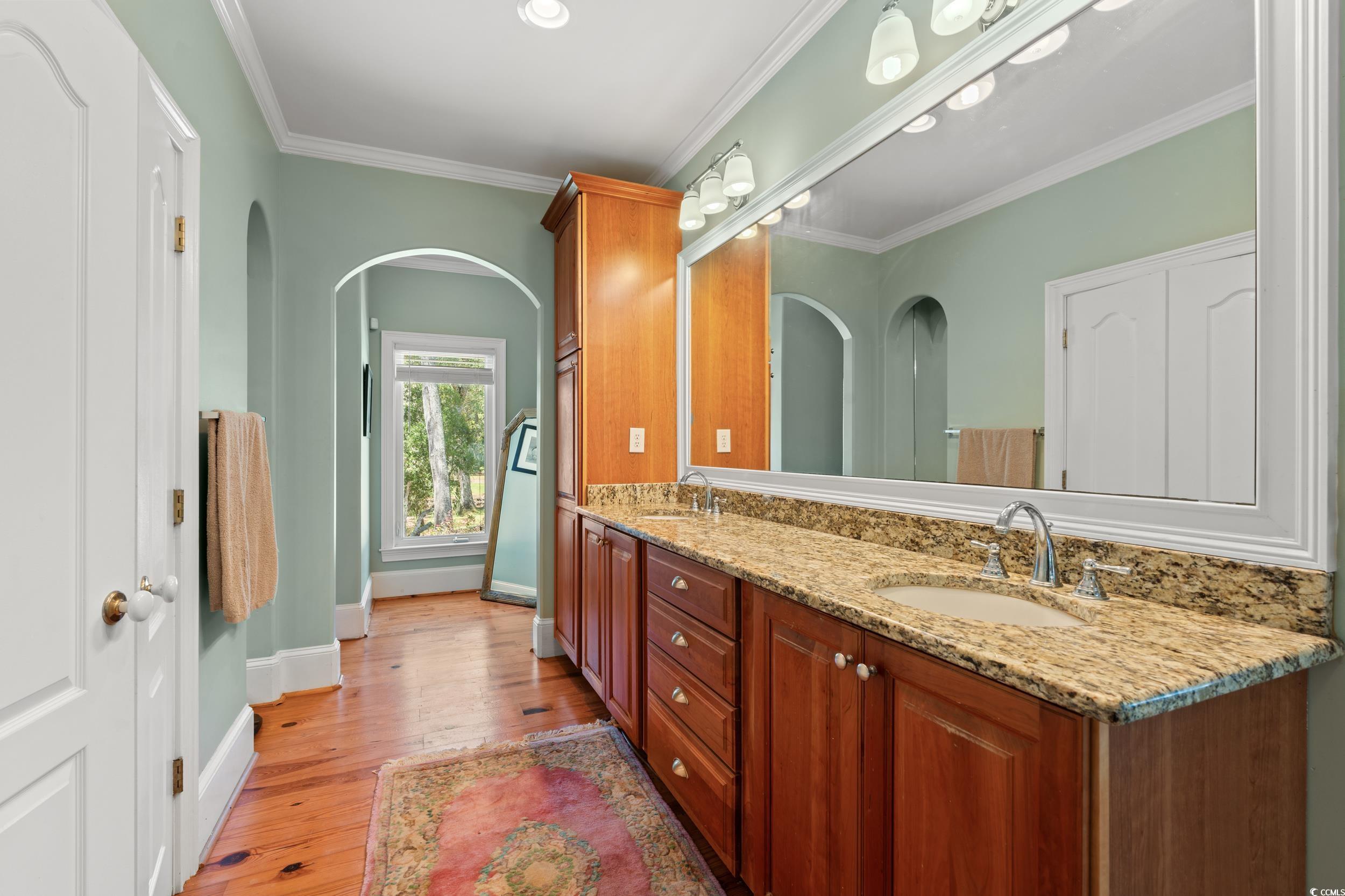2790 Fowler Road Loris, SC 29569 - Photo 15 of 40 Bathroom with ornamental molding, double vanity, and light wood-style floors