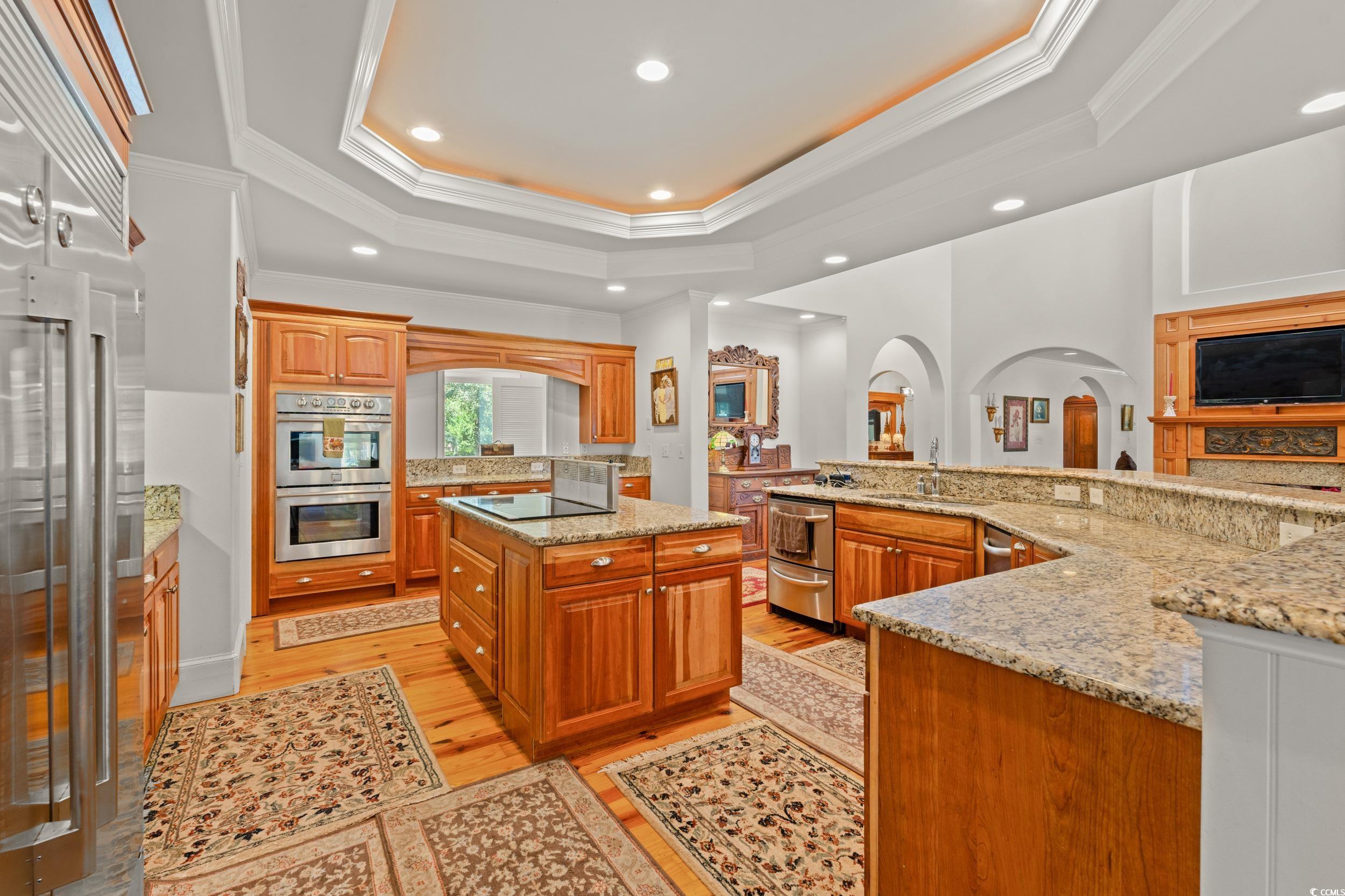 2790 Fowler Road Loris, SC 29569 - Photo 19 of 40 Kitchen with a center island with sink, ornamental molding, a tray ceiling, recessed lighting, and stainless steel appliances
