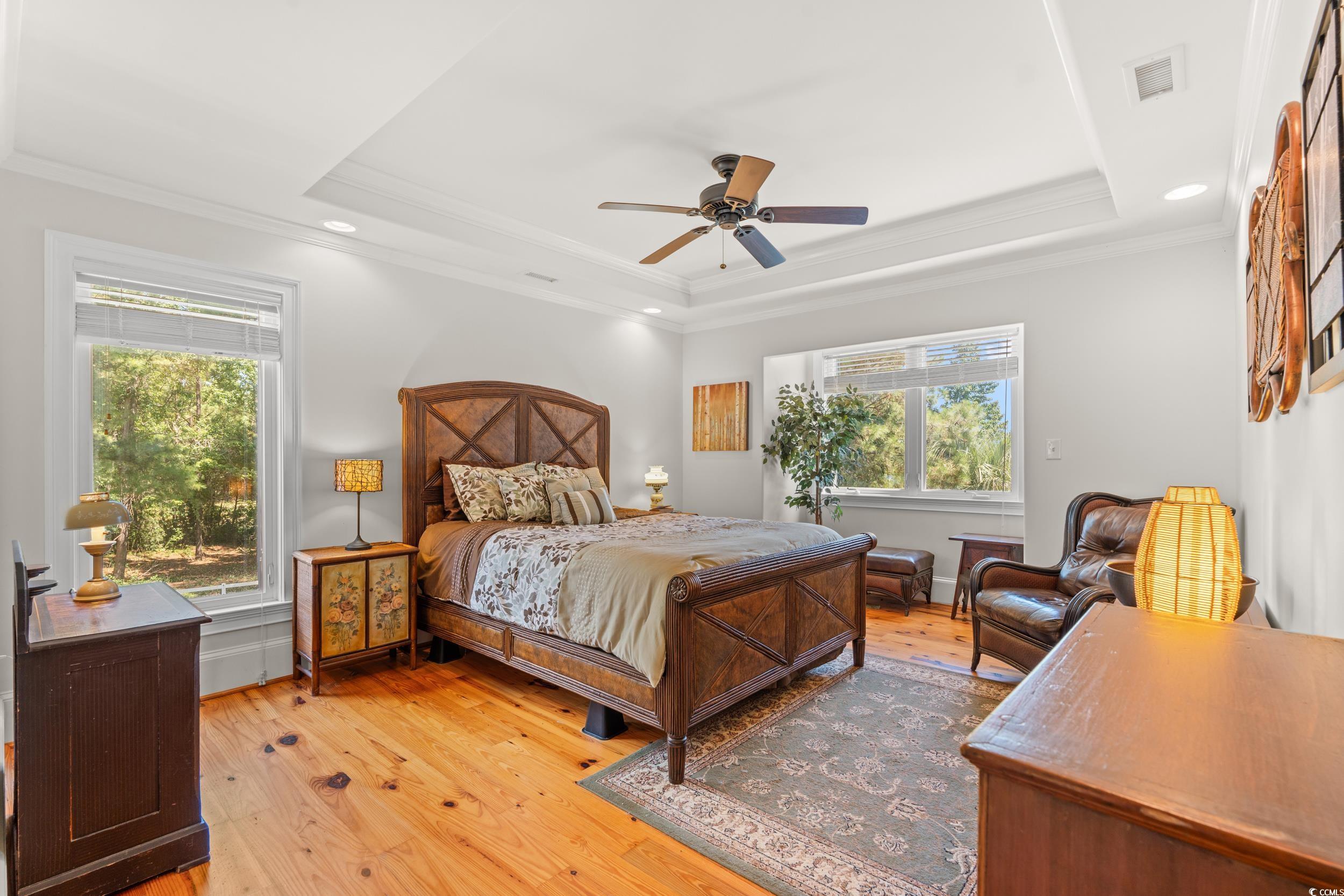 2790 Fowler Road Loris, SC 29569 - Photo 22 of 40 Bedroom with a raised ceiling, light wood-style floors, ornamental molding, ceiling fan, and recessed lighting