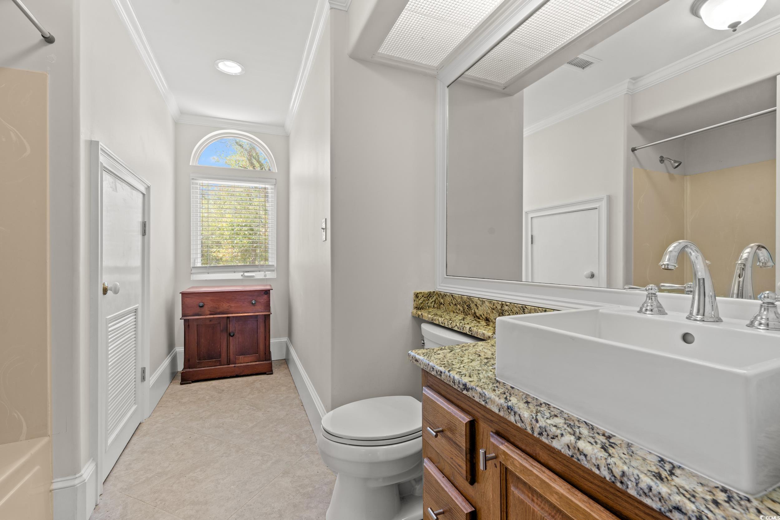 2790 Fowler Road Loris, SC 29569 - Photo 26 of 40 Full bathroom featuring crown molding, vanity, and shower / bath combination
