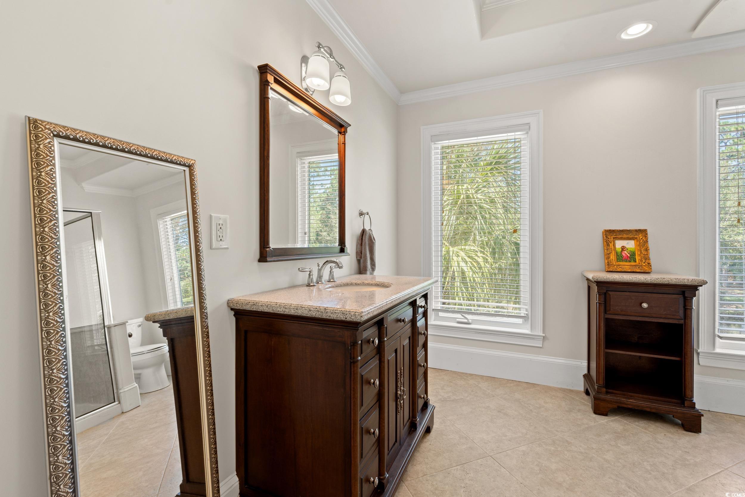 2790 Fowler Road Loris, SC 29569 - Photo 27 of 40 Full bathroom with crown molding, light tile patterned floors, vanity, recessed lighting, and a shower stall
