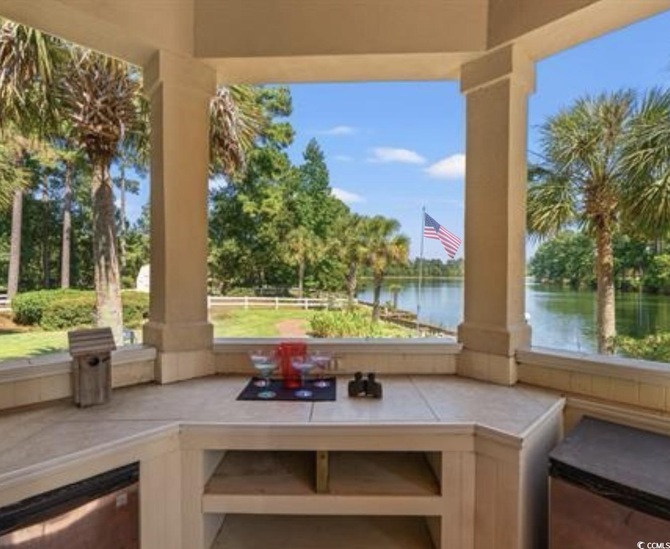 2790 Fowler Road Loris, SC 29569 - Photo 28 of 40 View of patio / terrace with a water view and view of scattered trees