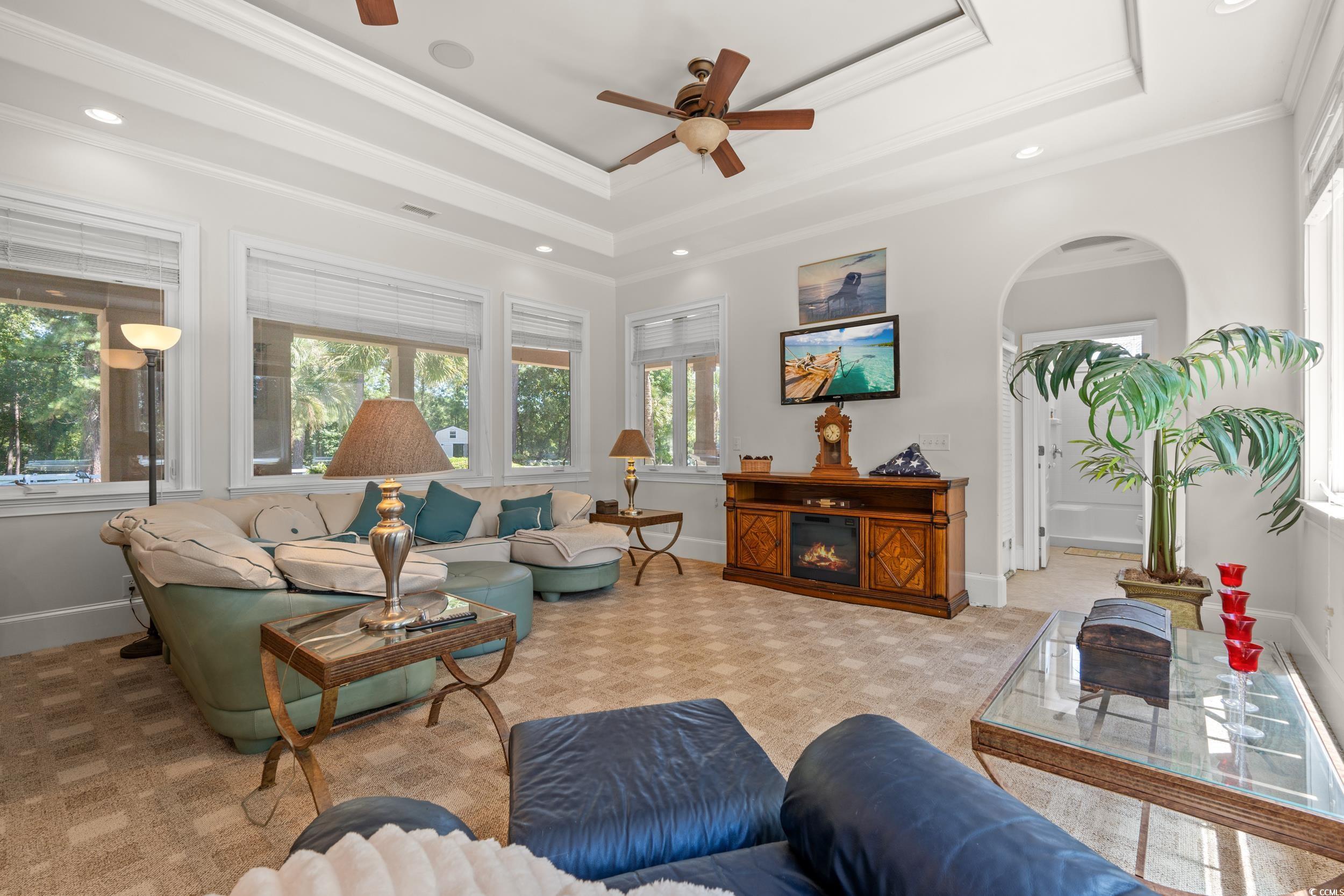 2790 Fowler Road Loris, SC 29569 - Photo 4 of 40 Living area featuring a raised ceiling, ceiling fan, arched walkways, ornamental molding, and recessed lighting