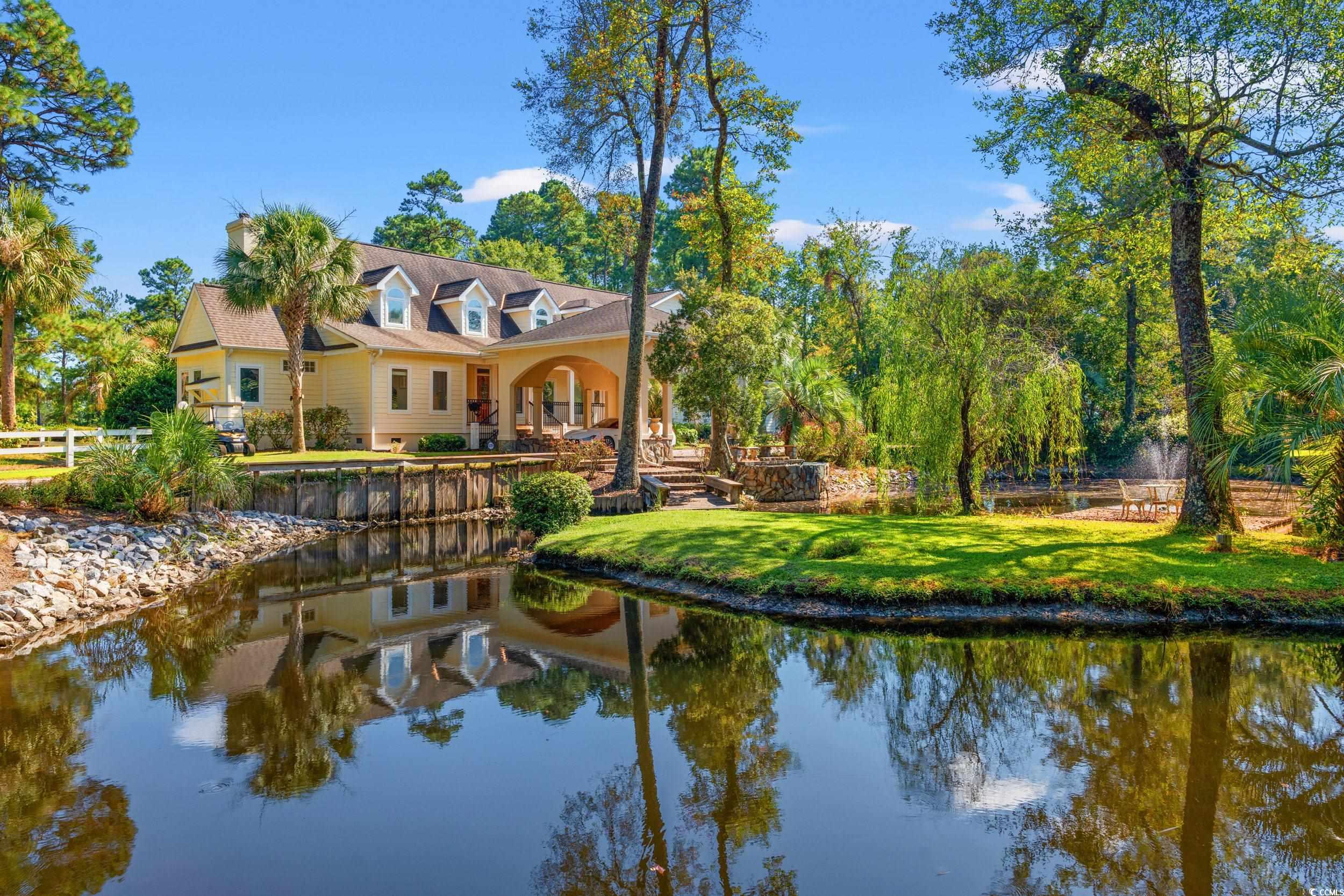 2790 Fowler Road Loris, SC 29569 - Photo 6 of 40 Rear view of house with a patio, a water view, and a lawn