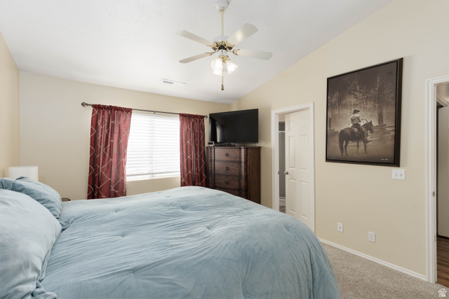161 West 950 South, Unit S4 St. George, UT 84770 - Photo 14 of 21 Bedroom featuring lofted ceiling, carpet, ceiling fan, and connected bathroom