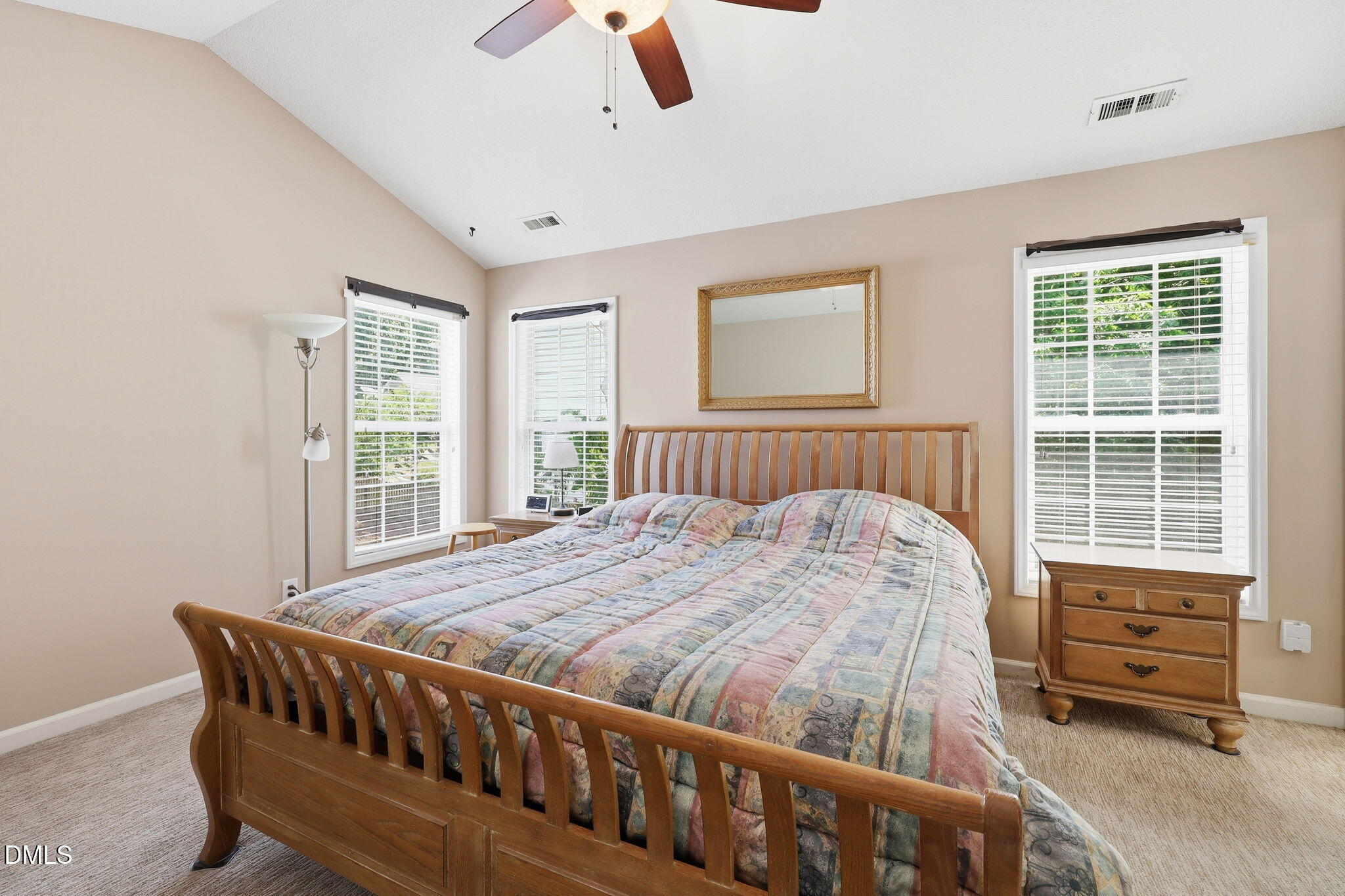 9105 Willow Valley Court Raleigh, NC 27617 - Photo 27 of 51 a bedroom with a bed and wooden floor