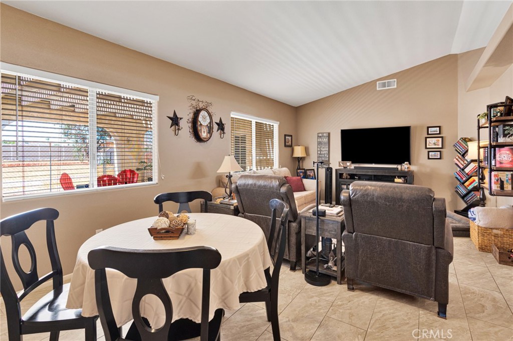 20403 Ochoa Road Apple Valley, CA 92307 - Photo 16 of 48 a living room with furniture and a flat screen tv