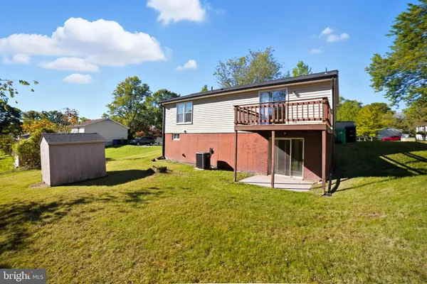 a view of backyard with a garden and entertaining space