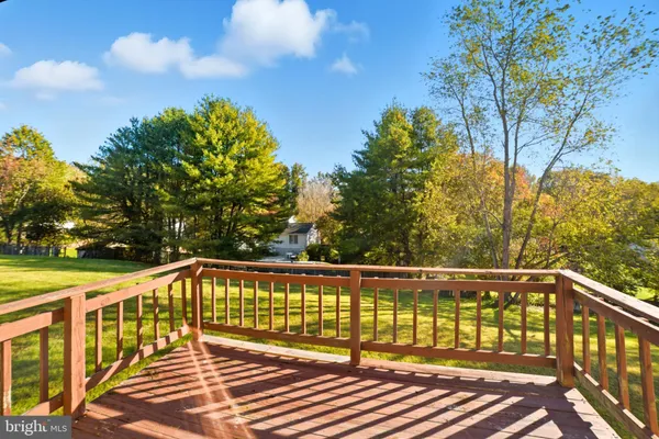 a view of a balcony with wooden floor