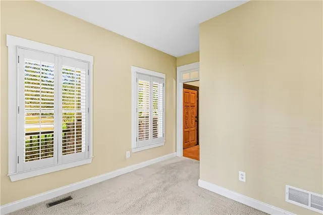 a kitchen with stainless steel appliances granite countertop a sink a refrigerator and a stove