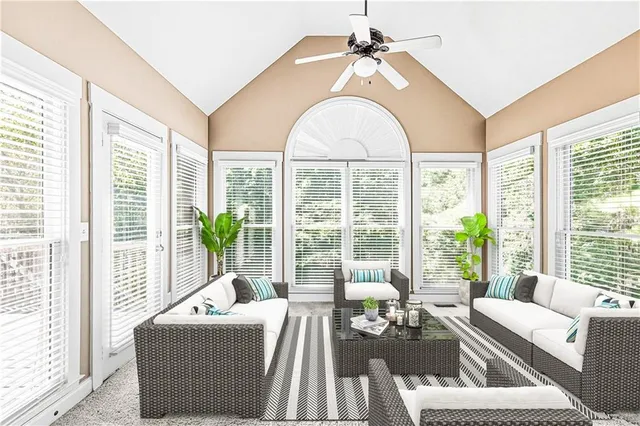 a view of a room with a ceiling fan