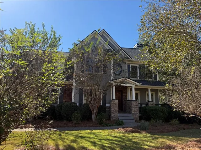 a front view of a house with a yard