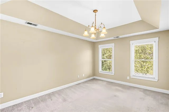 a view of a swimming pool with an outdoor seating