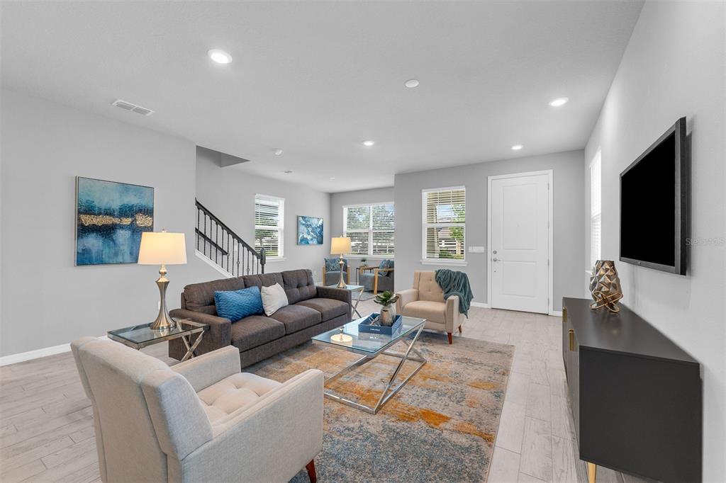 2765 Franklin Road St. Cloud, FL 34771 - Photo 2 of 29 a living room with furniture and a flat screen tv