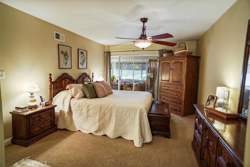 19334 Oak Crossing Road Newhall, CA 91321 - Photo 11 of 36 a spacious bedroom with a bed and ceiling fan
