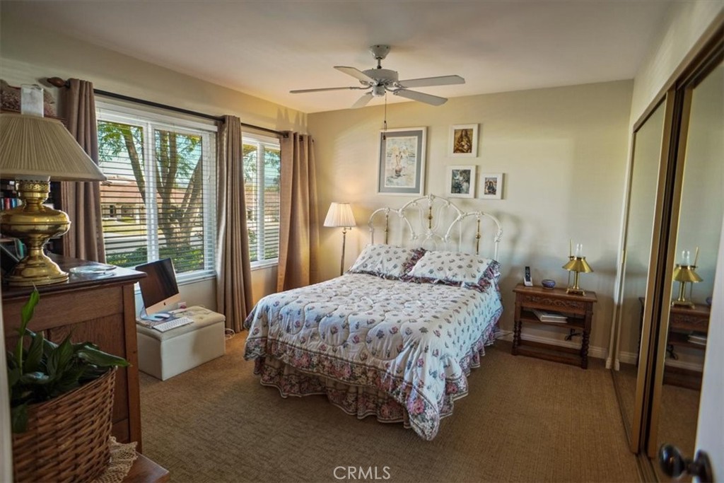19334 Oak Crossing Road Newhall, CA 91321 - Photo 14 of 36 a bedroom with a bed and a chandelier
