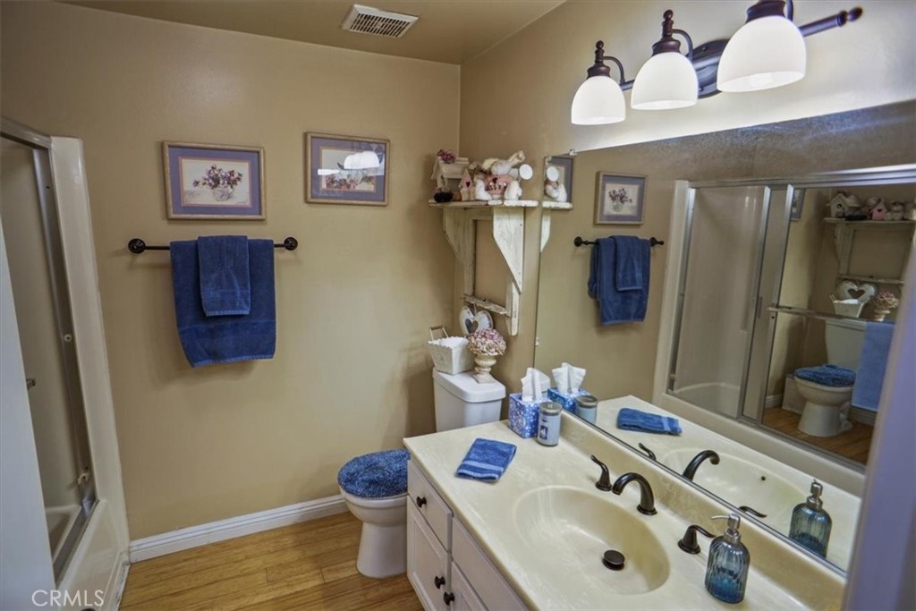 19334 Oak Crossing Road Newhall, CA 91321 - Photo 15 of 36 a bathroom with a sink vanity and mirror