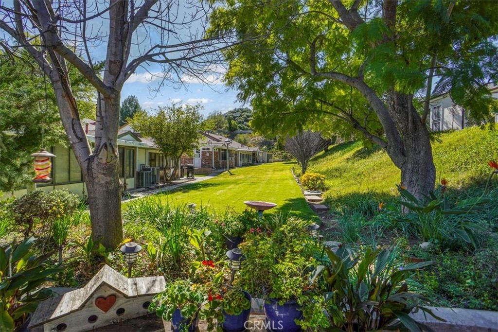 19334 Oak Crossing Road Newhall, CA 91321 - Photo 16 of 36 a view of swimming pool with a garden