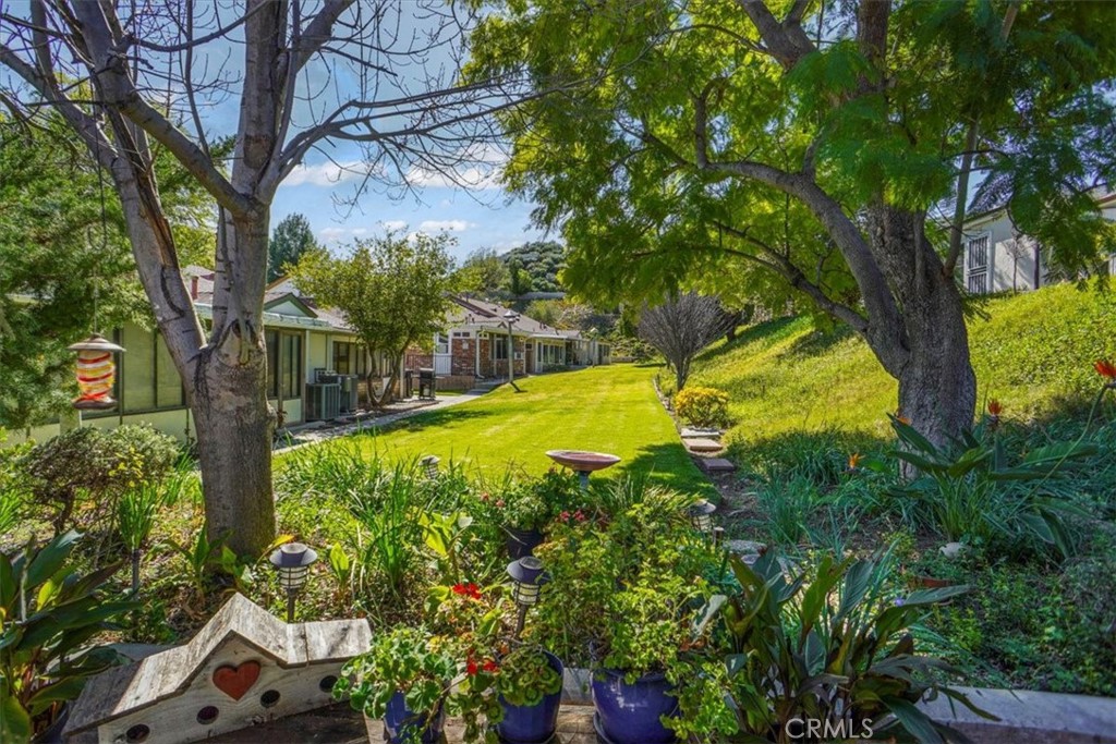 19334 Oak Crossing Road Newhall, CA 91321 - Photo 16 of 36 a view of swimming pool with a garden