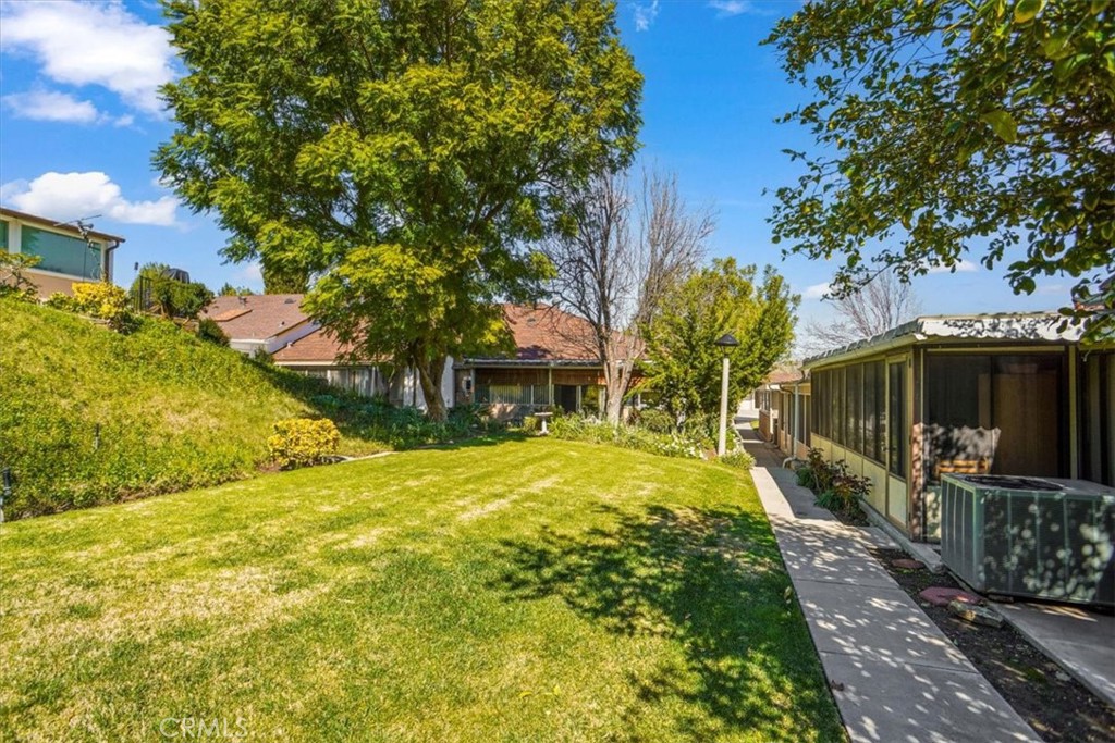 19334 Oak Crossing Road Newhall, CA 91321 - Photo 17 of 36 a yellow house with trees in front of it