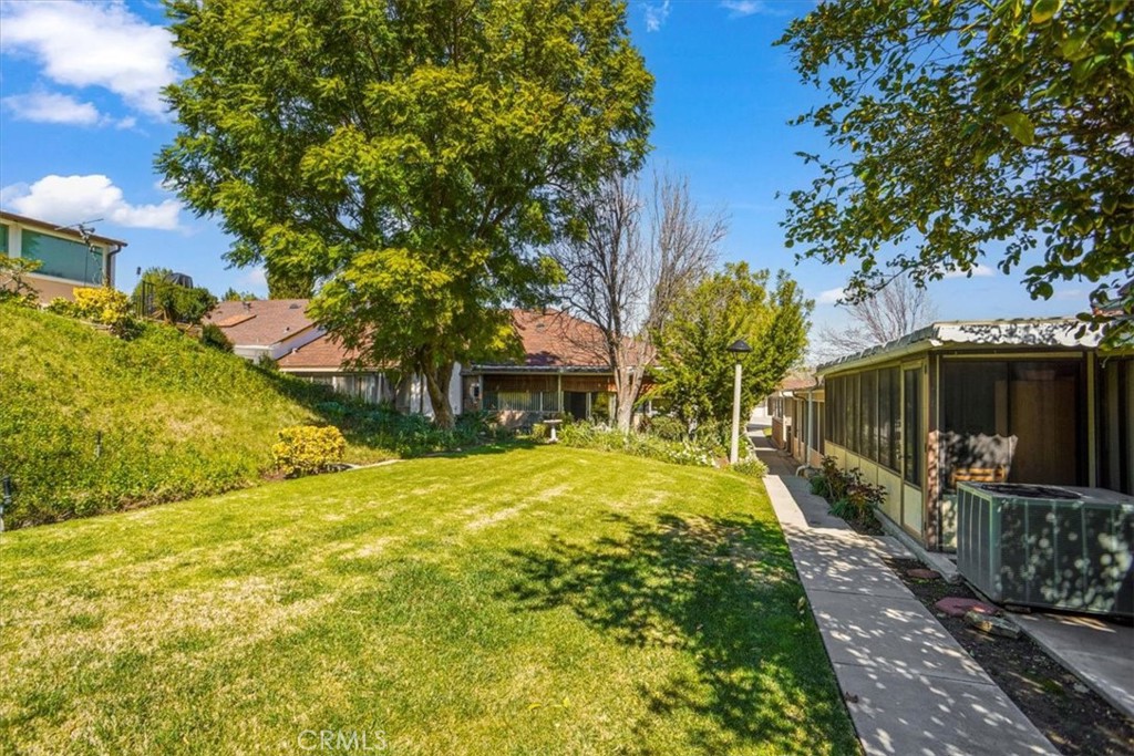 19334 Oak Crossing Road Newhall, CA 91321 - Photo 17 of 36 a yellow house with trees in front of it