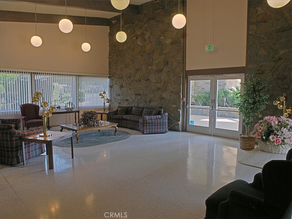 19334 Oak Crossing Road Newhall, CA 91321 - Photo 33 of 36 a living room with furniture and a large window