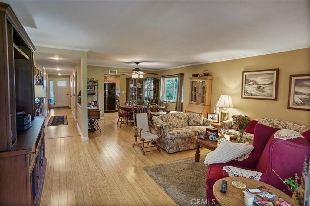 19334 Oak Crossing Road Newhall, CA 91321 - Photo 4 of 36 a living room with furniture and a wooden floor