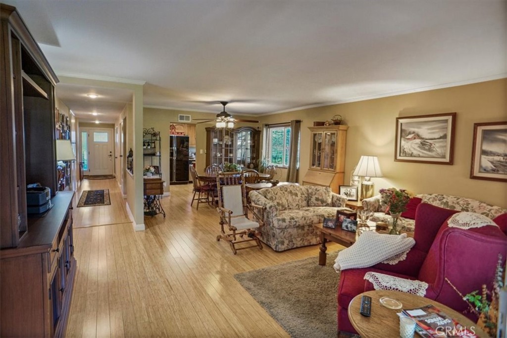 19334 Oak Crossing Road Newhall, CA 91321 - Photo 4 of 36 a living room with furniture and a wooden floor