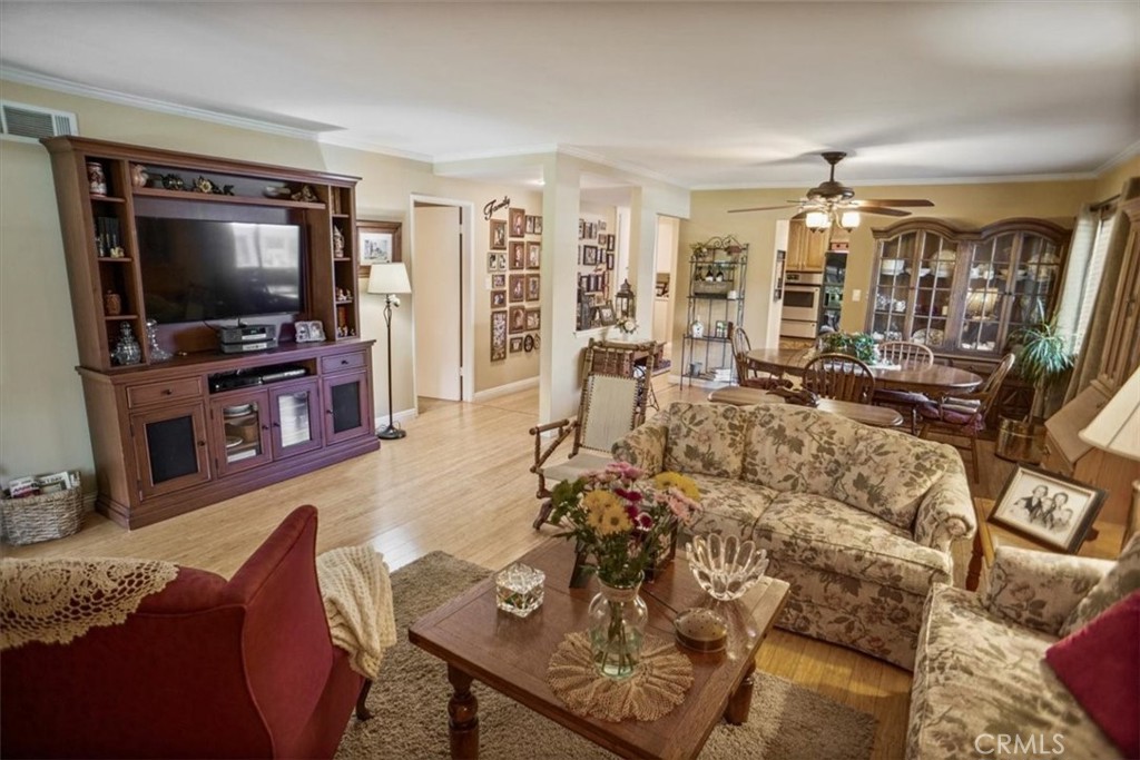 19334 Oak Crossing Road Newhall, CA 91321 - Photo 5 of 36 a living room with furniture and a flat screen tv